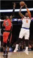  ?? FRANK FRANKLIN II/THE ASSOCIATED PRESS ?? J.R. Smith shoots on Terrence Ross.