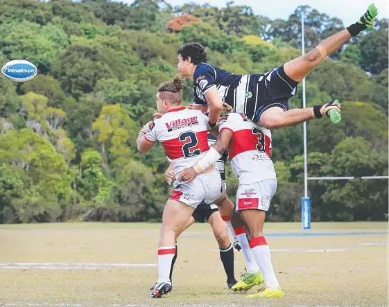  ??  ?? Tweed Seagulls winger Brayden McGrady leaps for the ball during their win over Redcliffe at Piggabeen Sports Complex. Picture: SMP IMAGES