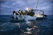  ?? U.S. NAVY VIA AP, FILE ?? This image provided by the U.S. Navy shows sailors assigned to Explosive Ordnance Disposal Group 2 recovering a high-altitude surveillan­ce balloon off the coast of Myrtle Beach, S.C., on Feb. 5.