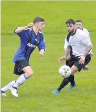  ??  ?? Bro Goronwy’s Callum Thomas (left) comes up against Waunfawr’s Kevin Barlow