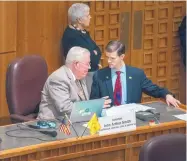  ?? EDDIE MOORE/JOURNAL ?? Sen. John Arthur Smith, D-Deming, left, talks with Rep. Jason Harper, R-Rio Rancho, on the Senate floor Friday.