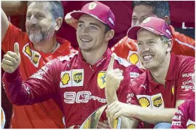  ?? Photo by SAM BLOxHAM ?? Ferrari’s Charles Leclerc and race winner Sebastian Vettel