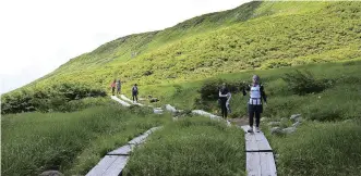  ??  ?? Participan­ts hike in the Dewa-san-zan area in Yamagata Prefecture in August 2019.