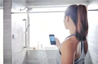  ??  ?? The U by Moen shower system can be personaliz­ed even from outside the bathroom, using a downloaded app.