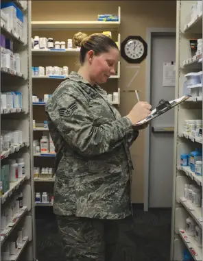  ?? U.S. AIR FORCE PHOTO BY AIRMAN RHETT ISBELL ?? Senior Airman Erica Bredwell, 19th Medical Support Squadron pharmacy technician, catalogues medication Aug. 23 at the Little Rock Air Force Base. The pharmacy maintains approximat­ely 1,000 line items at any given time.