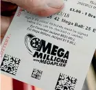  ?? AP ?? The Mega Millions lottery jackpot winner can take a US$877.8 million lump-sum or the full US$1.537 billion spread out over 30 years.
