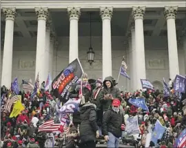  ?? Kent Nishimura Los Angeles Times ?? A CROWD consisting mostly of Donald Trump backers gathers outside the U.S. Capitol on Jan. 6, 2021. Legal experts are debating the meaning of “insurrecti­on.”