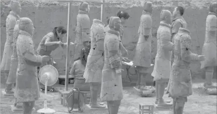  ??  ?? CHINESE archaeolog­ists at work in the extended excavation of the Pit One of the Terracotta Warriors and Horses Museum in Xian. — AFP