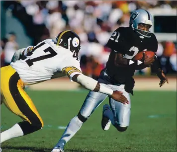  ?? GETTY IMAGES — 1984 ?? Raiders wide receiver Cliff Branch, running past the Steelers Mel Blount, is a good possibilit­y to make the Hall of Fame.