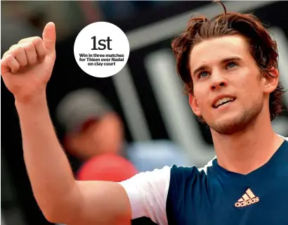  ?? — AFP ?? Win in three matches for Thiem over Nadal on clay court Austria’s Dominic Thiem celebrates after defeating Spain’s Rafael Nadal at the Italian Open on Friday.