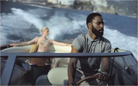  ?? FOTO: WARNER BROS./DPA ?? Tolle Männer, schöne Frauen: „Tenet“mit John David Washington und Elizabeth Debicki hat alles, was zu einem Agentenfil­m dazugehört.