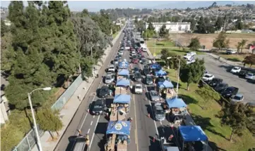  ?? Photo courtesy of LA Regional Food Bank. ?? The global pandemic and related economic collapse has created large numbers of people who are new to food insecurity and never imagined they would be in need of food assistance.