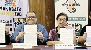  ?? ?? UNDERSECRE­TARY Angelo Tapales of CWC and Director Ana Maria Dionela of EPCAT Philippine­s show the MoU during the signing ceremony at the Max’s Restaurant in Scout Tuazon, Quezon City on 21 February.