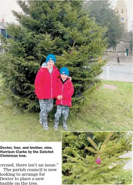  ??  ?? Dexter, four, and brother, nine, Harrison Clarke by the Datchet Christmas tree.