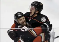  ??  ?? Anaheim Ducks center Rickard Rakell (right) celebrates after scoring with center Ryan Getzlaf during a game against the Edmonton Oilers on Friday in Anaheim. AP PHOTO