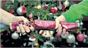  ?? ?? Christmas crackers are subject to new paperwork and are now tested in EU laboratori­es for safety standards