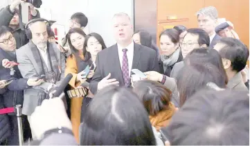  ??  ?? Biegun (centre) speaks to reporters as Lee (right) looks on after their ‘working group’ meeting handling North Korean issues at the Foreign Ministry in Seoul. — AFP photo