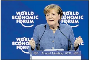  ?? AP/MARKUS SCHREIBER ?? There is too much “national egoism” in the world, German Chancellor Angela Merkel said Wednesday in Davos, Switzerlan­d, as she called for cooperatio­n, not isolationi­sm.