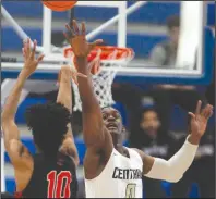  ??  ?? Little Rock Central’s Kiyler Hudson (right) attempts to block the shot of Fort Smith Northside’s Jacob Joe during their Class 6A boys state semifinal March 7 in Bryant. Central’s state final against Conway, originally scheduled for March 14, is among the eight championsh­ip basketball games that were canceled Monday by the Arkansas Activities Associatio­n.
(Arkansas Democrat-Gazette/Thomas Metthe)