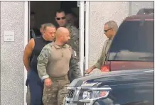  ?? Associated Press ?? This frame grab from WPLG-TV shows FBI agents escorting Cesar Sayoc, in sleeveless shirt, in Miramar, Fla., on Oct. 26.