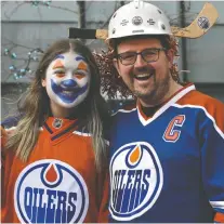  ?? ED KAISER ?? Gord Mcqueen and daughter Brooklyn, 13, show off their Oilers pride at the tailgate party in the ICE District Plaza Wednesday.