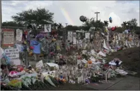  ?? THE ASSOCIATED PRESS ?? A rainbow is seen over the memorial outside of Marjory Stoneman Douglas High School in Parkland Fla., Monday.