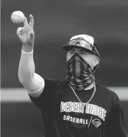  ?? MICHAEL CHOW, MICHAEL CHOW/THE REPUBLIC ?? Desert Ridge High School senior Ayden Markovich practices with his team in Mesa. His family left Arizona for Montana after his father killed himself. Montana doesn't have spring baseball, so he drove himself back to Arizona to play for Desert Ridge.