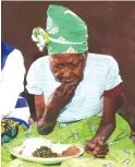  ?? ?? Gogo Ellah Guta eats a meal which was prepared and served to her by First Lady Dr Auxillia Mnangagwa at her homestead in Mutasa, Manicaland yesterday