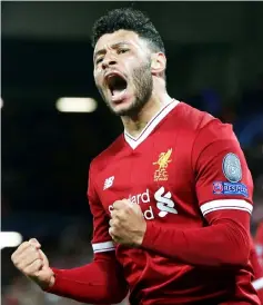  ??  ?? Liverpool’s Oxlade-Chamberlai­n celebrates scoring the second goal during the Champions League quarter final first Leg match against Manchester City at Anfield in Liverpool, Britain in this April 4 file photo. — Reuters photo