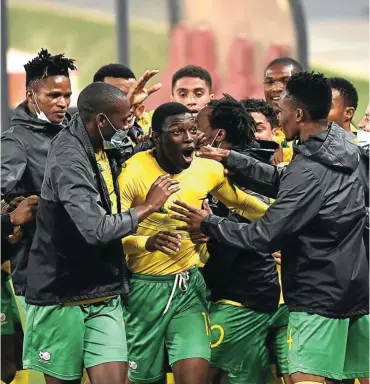  ?? Picture: Lefty Shivambu /Gallo Images ?? Bongokuhle Hlongwane of SA celebrates his goal with teammates during the 2022 Fifa World Cup qualifier against Ghana at FNB Stadium in Johannesbu­rg on Monday.