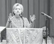  ?? Seth Wenig / Associated Press ?? Hillary Clinton speaks to members of Grace Baptist Church in Mount Vernon, N.Y., while on the campaign trail in April.