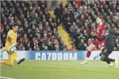  ??  ?? 0 Scotland captain Andy Robertson scores Liverpool’s second.