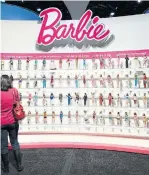  ?? STAN HONDA/AFP/GETTY IMAGES ?? Inspiratio­nal new versions of Barbie encourage young girls to embark on new careers.
