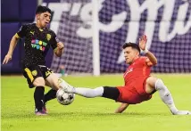  ?? CHANCEY BUSH/JOURNAL ?? NM United’s Cristian Nava, left, attempts to gain possession from Birmingham Legion FC’s Mikey Lopez during Saturday’s match.