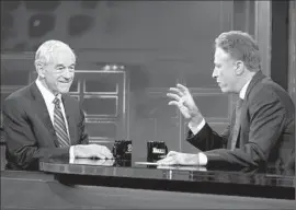  ?? Ronald Smits
PictureGro­up ?? JON STEWART, right, had Republican candidate Ron Paul as a guest in 2011.