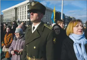  ?? ?? The Associated Press
Mourners attend the funeral of Ukrainian officer Dmytro Kotsiubail­o in Independen­ce Square in Kyiv, Ukraine, Friday. Kotsiubayl­o was killed in a battle near Bakhmut in the Donetsk region three days earlier.