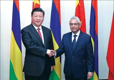  ?? PANG XINGLEI / XINHUA ?? President Xi Jinping meets Mauritian Prime Minister Pravind Jugnauth in Mauritius on Saturday. Earlier, Xi paid state visits to the United Arab Emirates, Senegal, Rwanda and South Africa, and attended the 10th BRICS Summit in Johannesbu­rg.