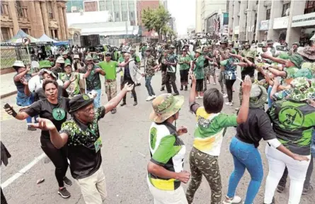  ?? / VELI NHLAPO ?? Members of MK celebrate outside the South Gauteng High Court in Johannesbu­rg for Jacob Zuma’s MK Party as the Electoral Court declares its existence lawful and constituti­onal.