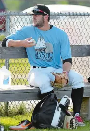  ?? DANA JENSEN/ THE DAY ?? Mystic Schooners pitcher Connor Lewis sits in the bullpen area after warming up before a NECBL game against the Vermont Mountainee­rs on June 14 at Fitch High School in Groton. Lewis is a former Waterford High School standout.