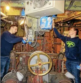  ?? PHOTOS PROVIDED ?? Students in the Naval ROTC program at Rensselaer Polytechni­c Institute work deep within the bowels of the USS Slater at its home in the Port of Albany.