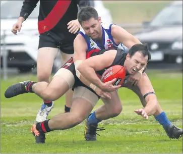  ??  ?? TAKING NO PRISONERS: Harrow-balmoral’s Rowan Hage collects Noradjuha-quantong player Cam Bruce in a tackle. Picture: PAUL CARRACHER