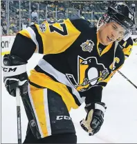  ?? AP PHOTO ?? Pittsburgh Penguins’ Sidney Crosby warms up before the team’s NHL game against the Calgary Flames in Pittsburgh on Tuesday. Entering the game, Crosby was three points away from 1,000 for his career.