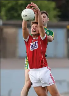  ??  ?? Roy Downey, Cork in action against Daniel O’Brien, Kerry during the Munster JFC Final Photo by Jim Coughlan