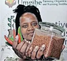  ?? ?? Nonhlanhla Joye, the founder and director of the Umgibe Farming Organics and Training Institute, took part in the Trade and Investment Indaba exhibition. She grows chillies from seeds to seedlings, and then refines them into spice once they have dried out. Photograph­er: Tumi Pakkies/African News Agency (ANA)