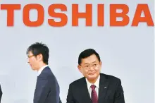  ?? AP-Yonhap ?? Then-Toshiba Chairman and CEO Nobuaki Kurumatani gets out of a seat after a press conference in Tokyo in this 2018 file photo.