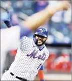  ?? Elsa / Getty Images ?? The Mets’ Jonathan Villar celebrates his hit that drove in the winning run against the Phillies during the first game of a doublehead­er Tuesday.