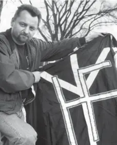  ?? RON BULL/TORONTO STAR FILE PHOTO ?? Droege shows off a Heritage Front banner in 1992.