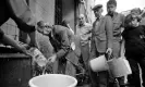  ?? Photograph: Krause, Johansen/Getty Images ?? Sarajevo residents collect water from a stand-pipe during the 47 month-long siege between the spring of 1992 and February 1996. More than 10,600 people were killed with a further 56,000 wounded or maimed.