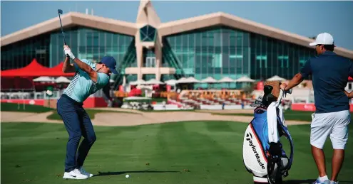  ??  ?? Rory McIlroy hits a shot in practice ahead of the Abu Dhabi HSBC Golf Championsh­ip