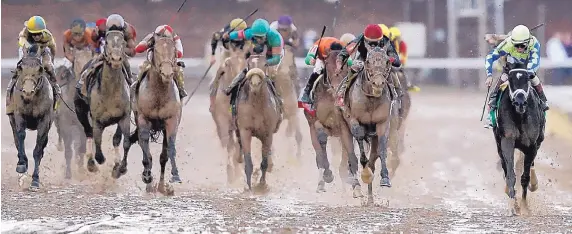  ?? MATT SLOCUM/ASSOCIATED PRESS ?? John Velasquex rides Always Dreaming, far right, to victory in the 143rd running of the Kentucky Derby on Saturday at Churchill Downs in Louisville, Ky. Always Dreaming became the fifth consecutiv­e Derby favorite to come through with a victory.
